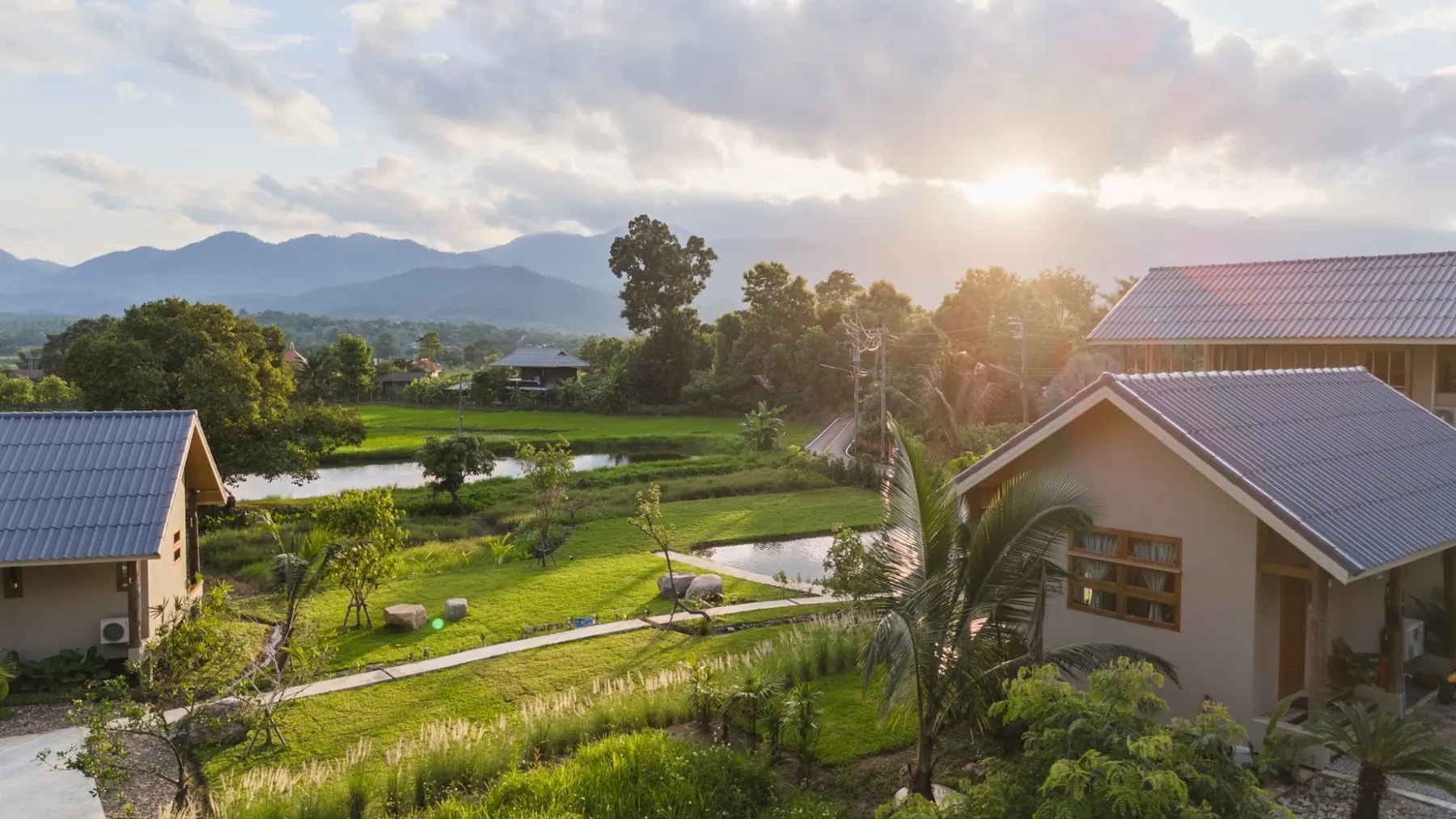 The sun low over the valley and the roofs of The Brown
